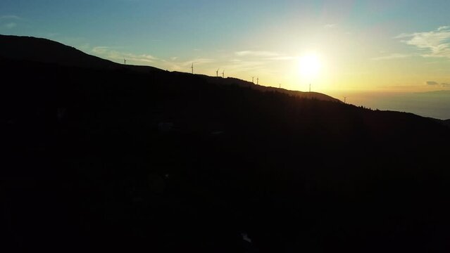 Flying over the beautiful mountain ranges at dusk in a morning