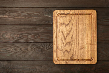 Cutting board on a textured marble kitchen table. Menu food card or recipes background concept.MOCKUP. Design. Place for text, copy space. The concept of food and cooking.