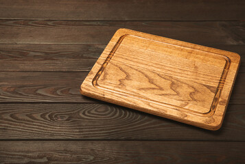 Cutting board on a textured marble kitchen table. Menu food card or recipes background concept.MOCKUP. Design. Place for text, copy space. The concept of food and cooking.