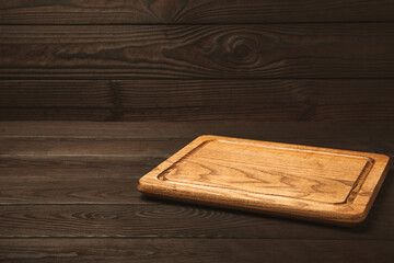 Cutting board on a textured marble kitchen table. Menu food card or recipes background concept.MOCKUP. Design. Place for text, copy space. The concept of food and cooking.