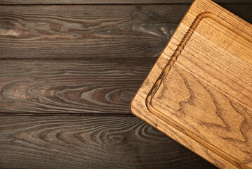 Cutting board on a textured marble kitchen table. Menu food card or recipes background...