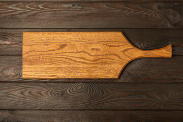 Cutting board on a textured marble kitchen table. Menu food card or recipes background concept.MOCKUP. Design. Place for text, copy space. The concept of food and cooking.