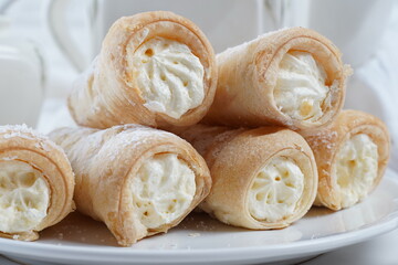 Puff rolls with vanilla cream. Delicious cream horns filled with vanilla cream