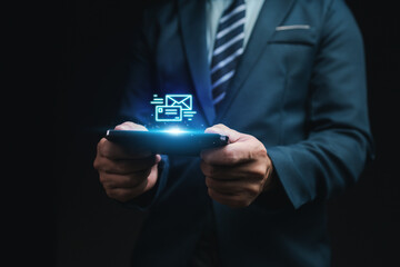 Person with email hologram, businessman with communication and work contact email. Business mailing concept and communication technology.