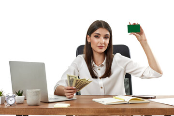attractive lady holding cash and plastic card at the table