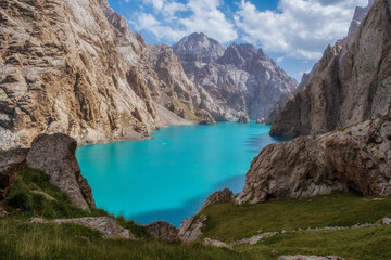 a Beautiful landscape of famous mountain Lake Kel Suu among the rocks. Located Kyrgyzstan at summer time