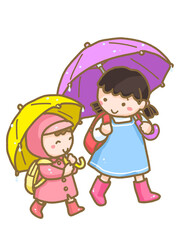 傘をさして登校する子供たち