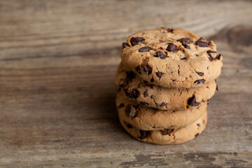Brown cookies on wooden background