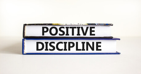 Positive discipline symbol. Concept words Positive discipline on beautiful books. Beautiful white table white background. Business psychology positive discipline concept. Copy space.