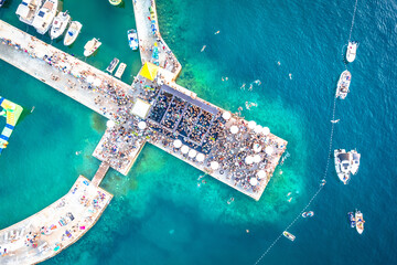 Beach party on pier aerial view