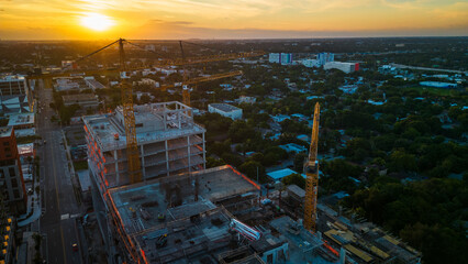 aerial sunset Miami florida construction site crane real estate rent building office house 