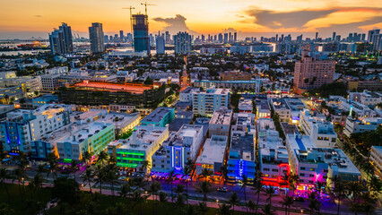Aerial of Miami South Beach illuminated at night at sunset ocean road iconic landmark 