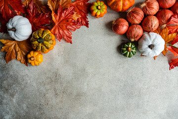Autumnal frame made with leaves and pumpkin