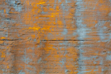 The background of the wall, stucco rough surface. Gold and blue. Backgrount or texture for design