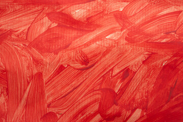 Red paint splatter and brush strokes on paper texture