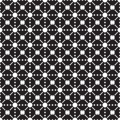 Seamless pattern with dots and flowers in black and white. Vector illustration.