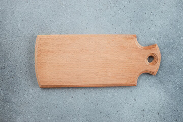 wooden cutting board on a light background. Long banner format. top view