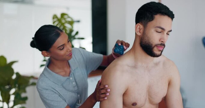 Ball, rehabilitation or man in physiotherapy to relax the body or shoulders for healing back pain. Physical therapy massage, Indian woman or physiotherapist talking or consulting an injured client