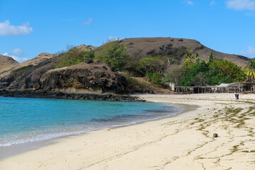 Obraz premium Kuta beach Lombok. Kuta Lombok is a small spread-out town in a beautiful bay lined by a long white sand beach, a beach with blue sky, a beach with sky and white sand, view of the beach in island