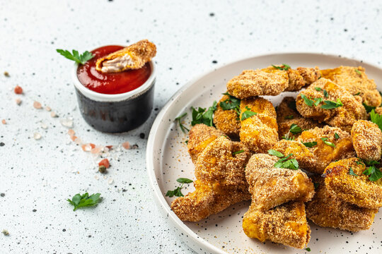 fried chicken nuggets with sauce on a light background, Restaurant menu, dieting, cookbook recipe top view