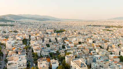 Fototapeta na wymiar Athens, Greece. Panorama of the capital during sunset. Roofs of houses, Aerial View
