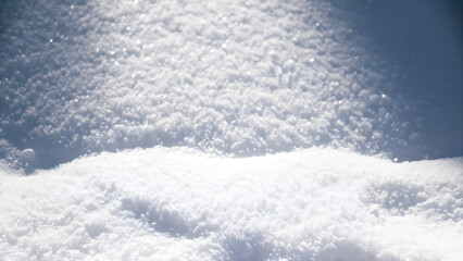 Obraz premium Fresh white snow texture top view. Perfection shining pure snowy background.