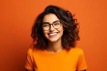 Obraz premium Photography generative AI image of a positive lovely smiling woman laughing having fun isolated on orange background