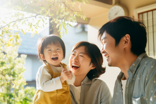 A joyful Japanese family of three enjoys quality time at  home, radiating love, and happiness in a beautiful outdoor portrait