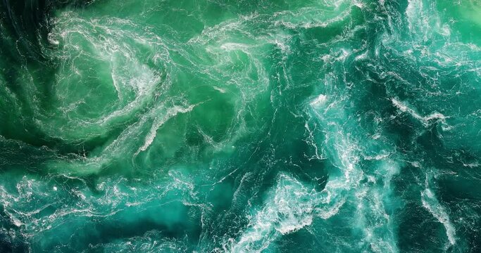 Blue waves of water of the river and the sea meet each other during high tide and low tide.