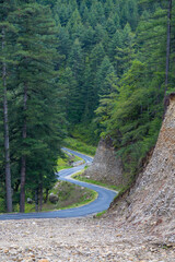 View of a winding road in a valley in Bhutan.