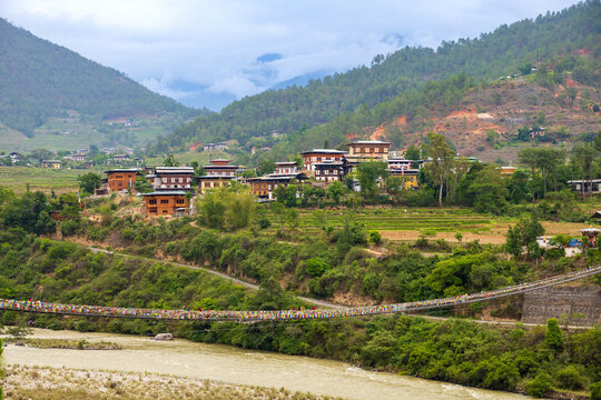 View of suspension bridge over river Mo with scenic mountains in the background
located in the Bumthang district of Bhutan.