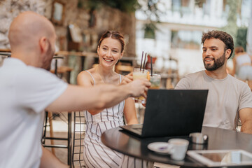 Successful Outcomes: Creative Business Team Discussing Project Development and Analyzing Statistics at Coffee Bar