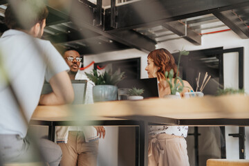 Multicultural Business Team Analyzing Statistics for Better Results in Corporate Office