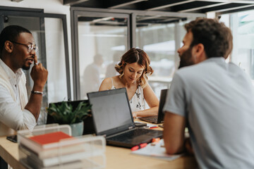 Successful Business Workshop: Multicultural Team of Businesspeople Analyzing Financial Statistics and Exchanging Ideas for Better Results