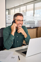 Happy busy mature mid aged business man professional expert or entrepreneur making phone call...