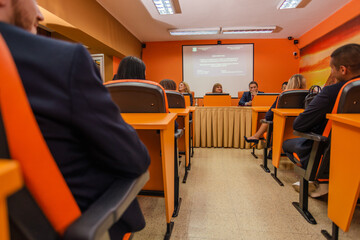 University students listening to the press conference