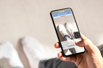 Man Trying Virtual Sneakers In Online Shop