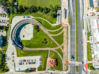 Tramway bidirectional elevated balloon loop on pillars and P+R, Park and Ride parking lot in...