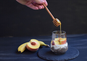 Healthy breakfast with chia seeds, yogurt, fruit and honey