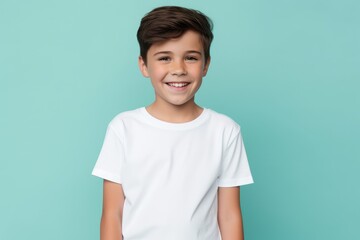 a child wearing white t-shirt looking at the camera, t-shirt mockup