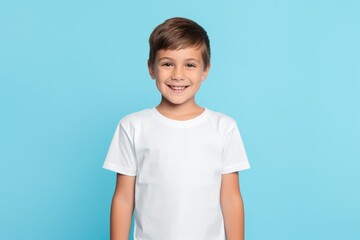 a child wearing white t-shirt looking at the camera, t-shirt mockup