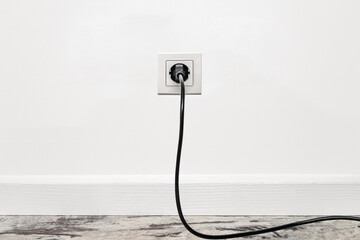 White outlet on white wall