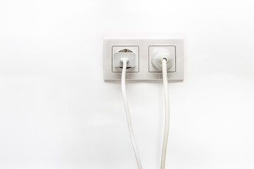 White double outlet on white wall