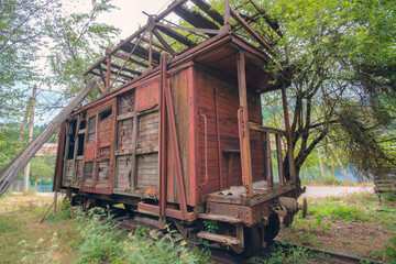 Fototapeta na wymiar Old vintage abandoned cargo train wooden carriage