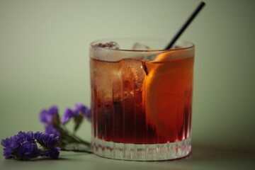 Whiskey in glass with flowers