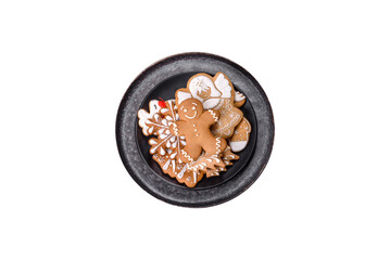 Gingerbread, Christmas tree decorations, dried citrus fruits on a gray concrete background