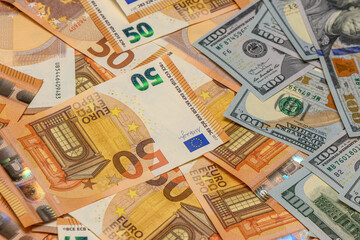 100 dollar and 50 euro bills as background 26