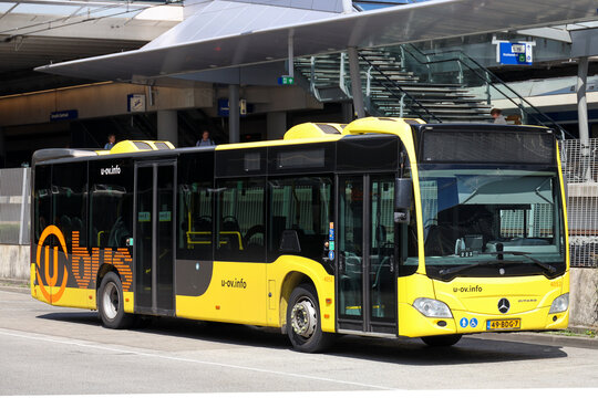 City bus in yellow color of U-OV runned by Qbuzz in Utrecht