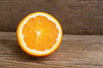Sliced orange on wooden background