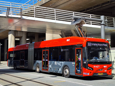 VDL Citea VDL Citea SLFA-180 R-NET articulated Electric city bus by GVB in Amsterdam City on charger via roof.